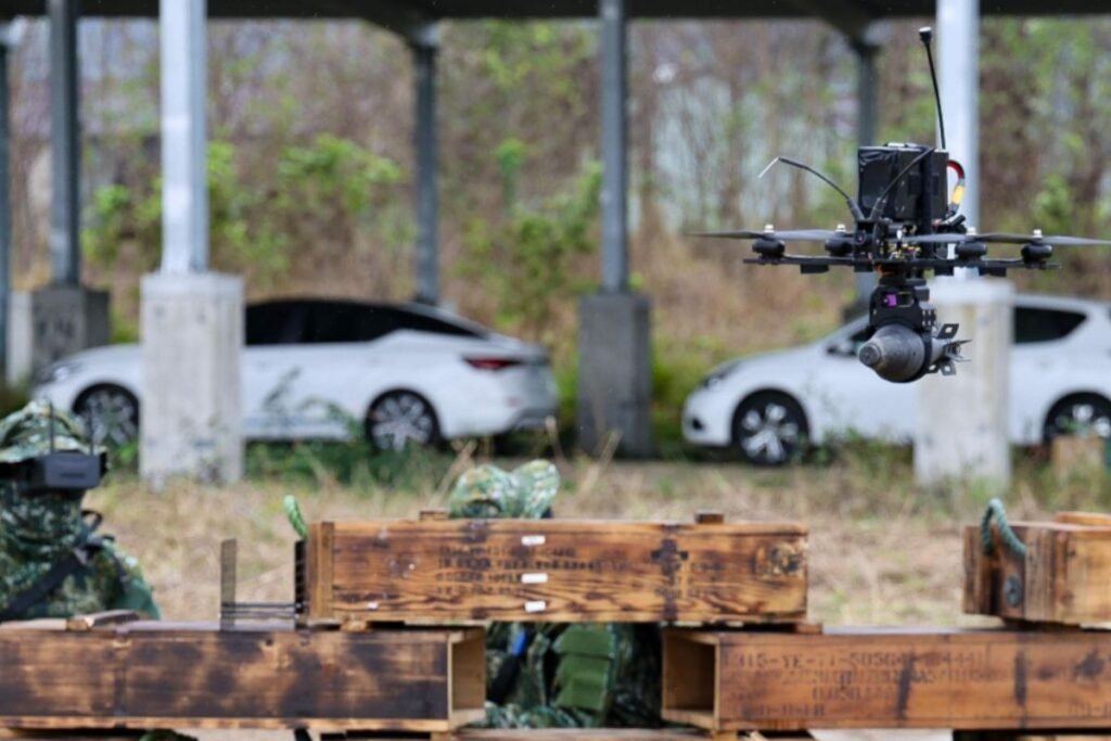 A reconnaissance team first deployed a surveillance drone discreetly, using a remote-control tablet to launch and guide it toward the suspected enemy position. (Photo: Wang Zichang)
